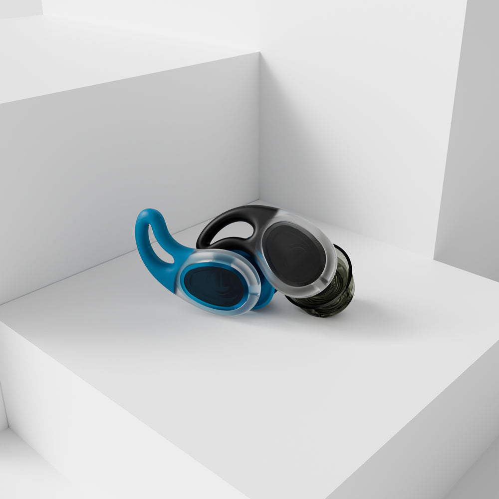Pair of reusable water-sports earplugs displayed on a white surface.